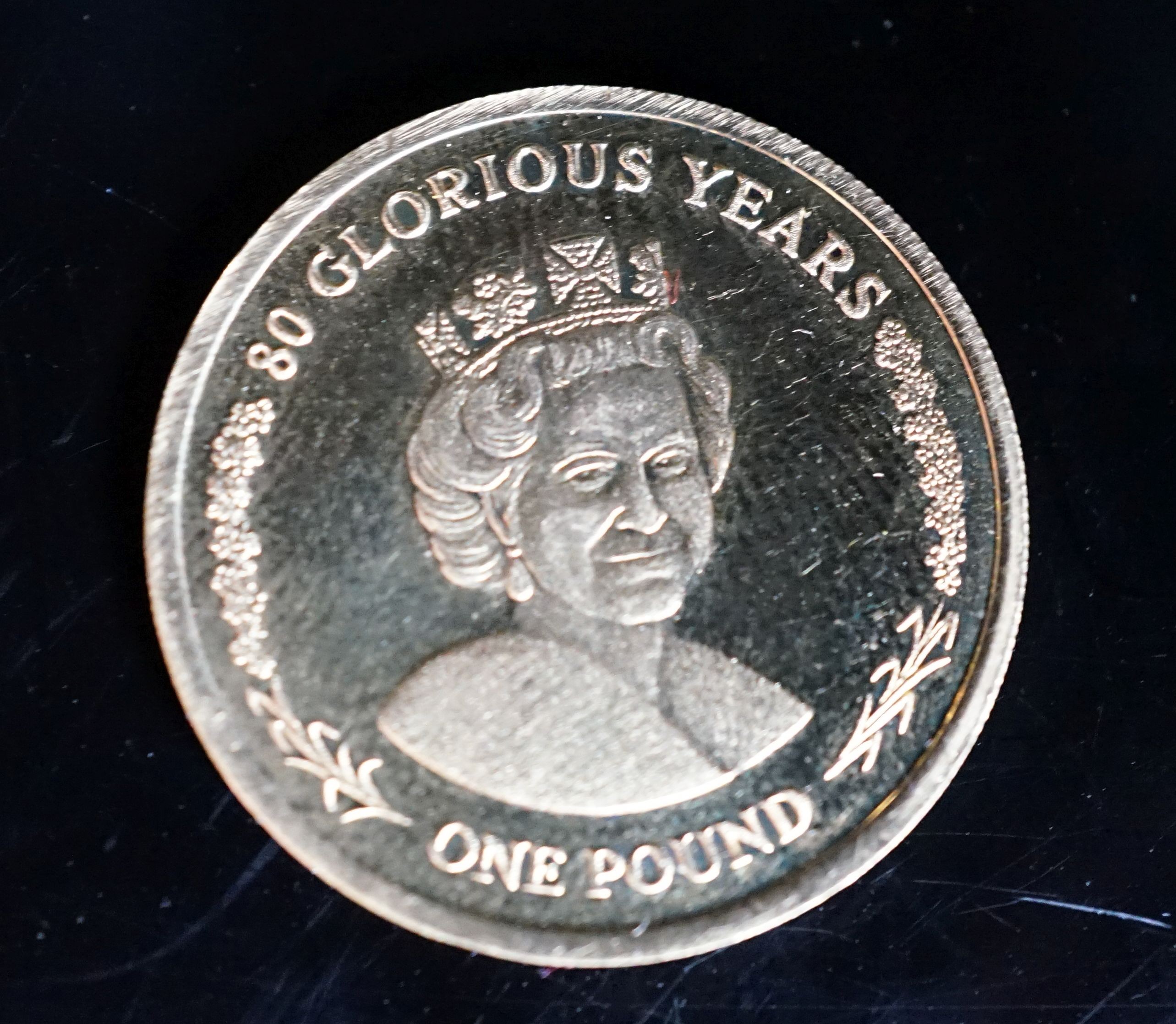 A 2006 Elizabeth II Gibraltar gold one pound coin.